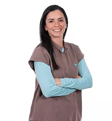 Dr. Fabiola Camacho smiling with her arms crossed